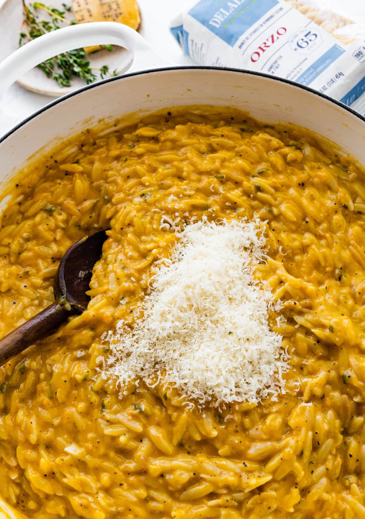 How to make Butternut Squash Orzo Recipe Step-by-step: add the parmesan cheese to the butternut squash orzo.