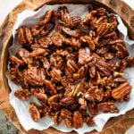 Easy Candied Pecans Recipe in a wooden serving platter.
