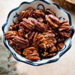 Easy Candied Pecans Recipe in a blue and white jar.