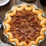 baked Maple Pecan Pie (without Corn Syrup) in a mint green pie plate.