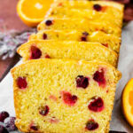 Leaning slices of cranberry orange bread.