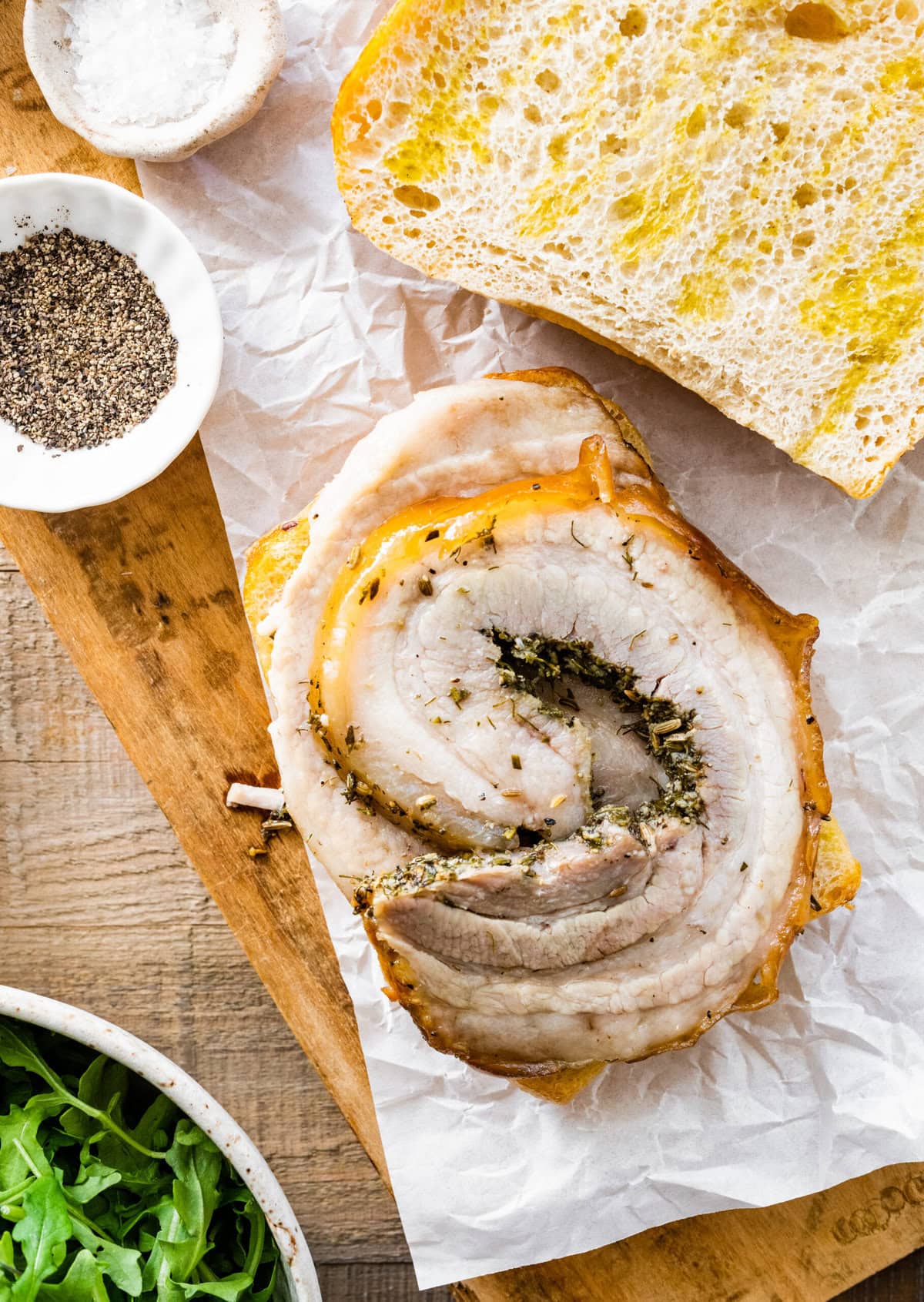 how to make porchetta sandwich recipe. Add the leftover and warmed porchetta to the ciabatta bread.