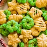 All the decorated spritz cookies on a beautiful festive cookie platter ready to serve.
