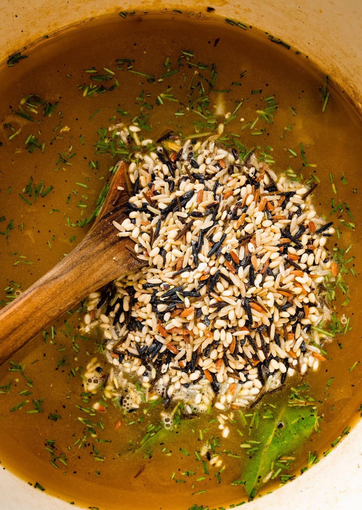 How to make creamy chicken wild rice soup step-by-step photos: stir everything in pot to combine and cook.