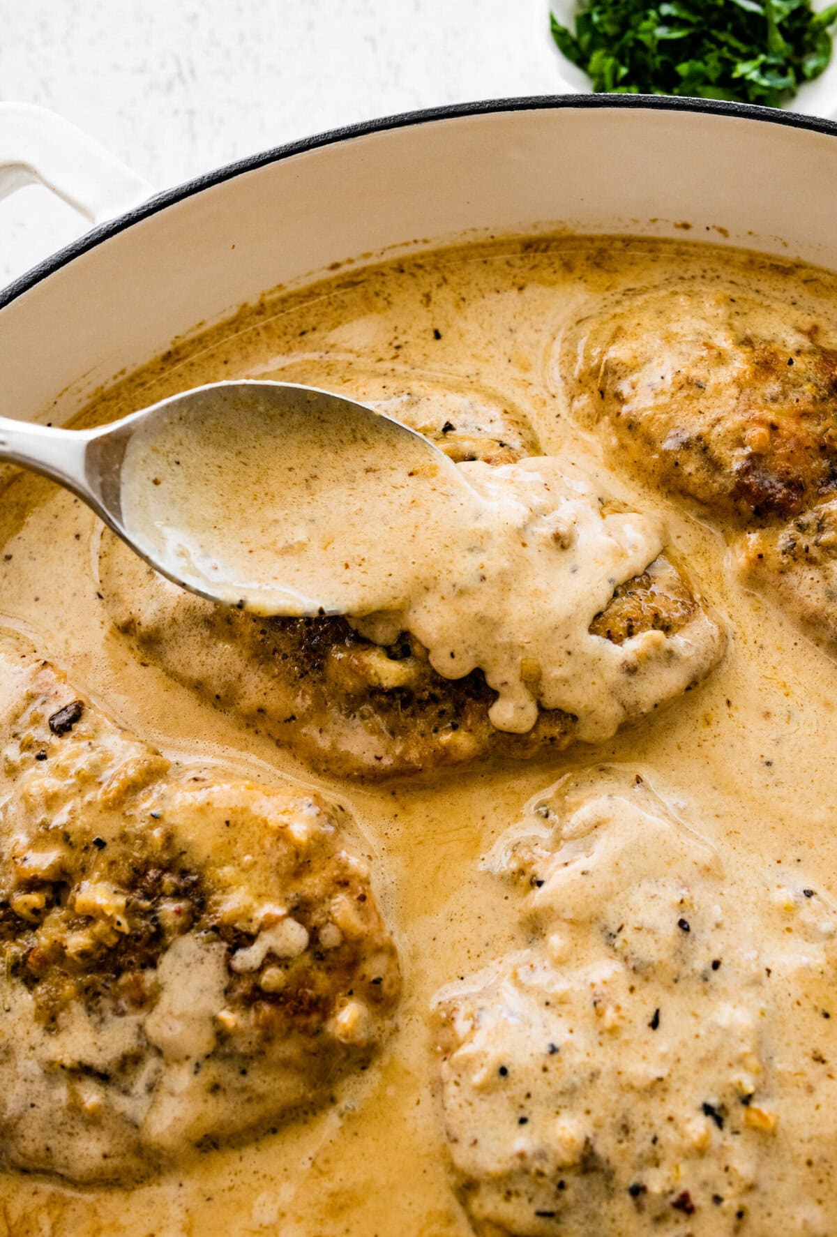 Spoon lemon cream sauce over the chicken.