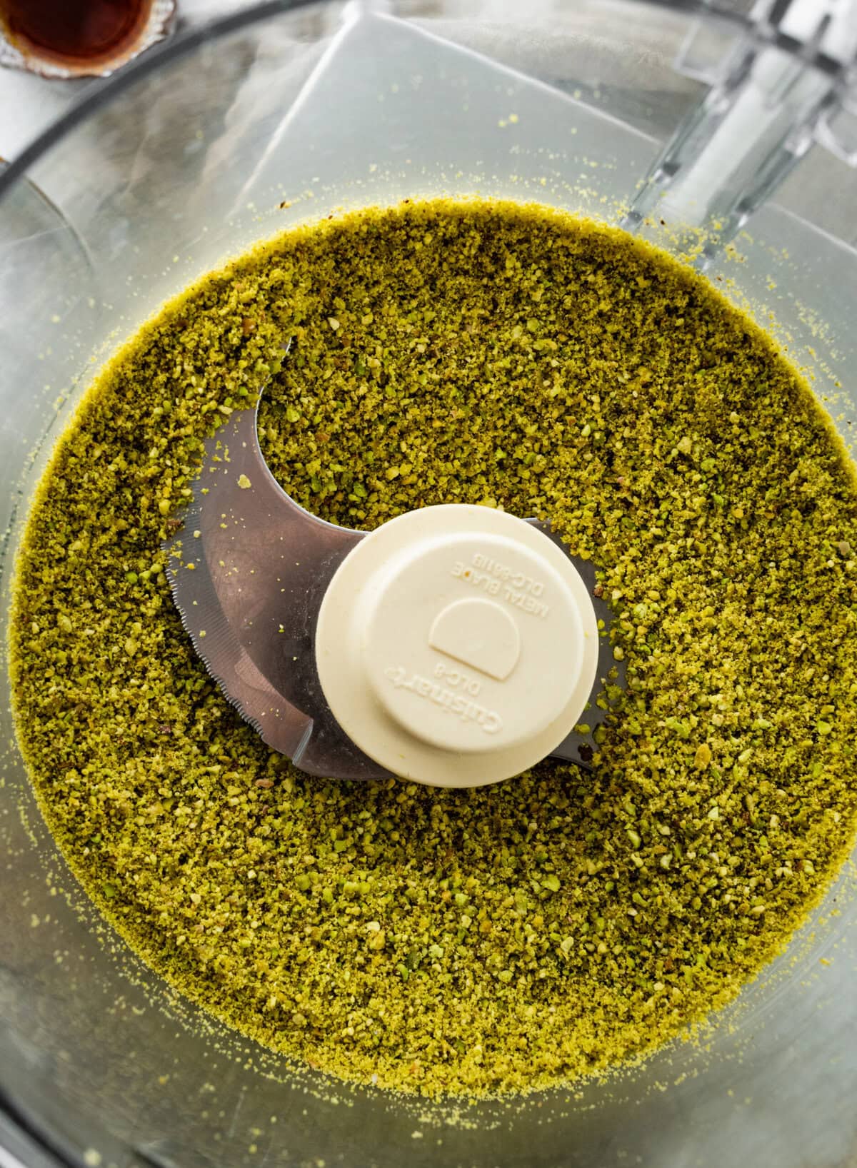 pistachios ground into a powder in a food processor.