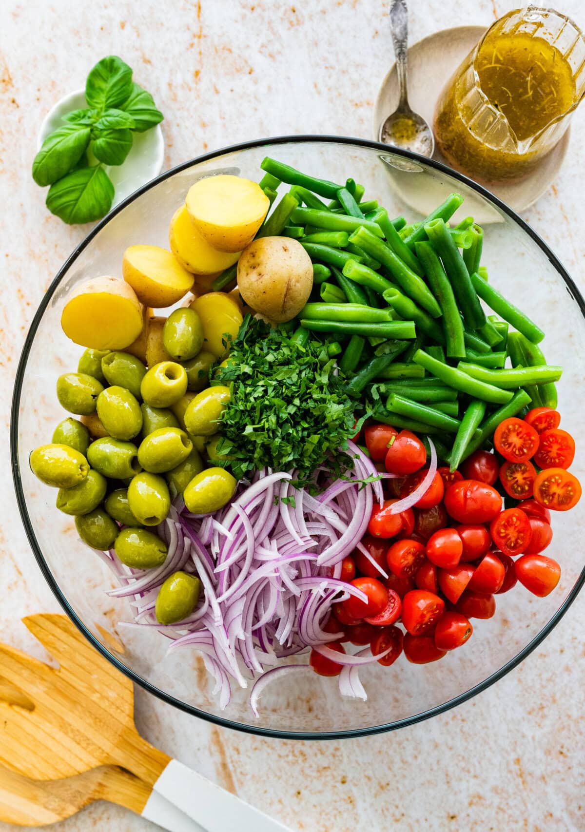 how to make Italian potato salad recipe: all salad ingredients in a large glass bowl.