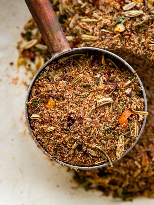 close up of a teaspoon with Italian sausage seasoning in it.