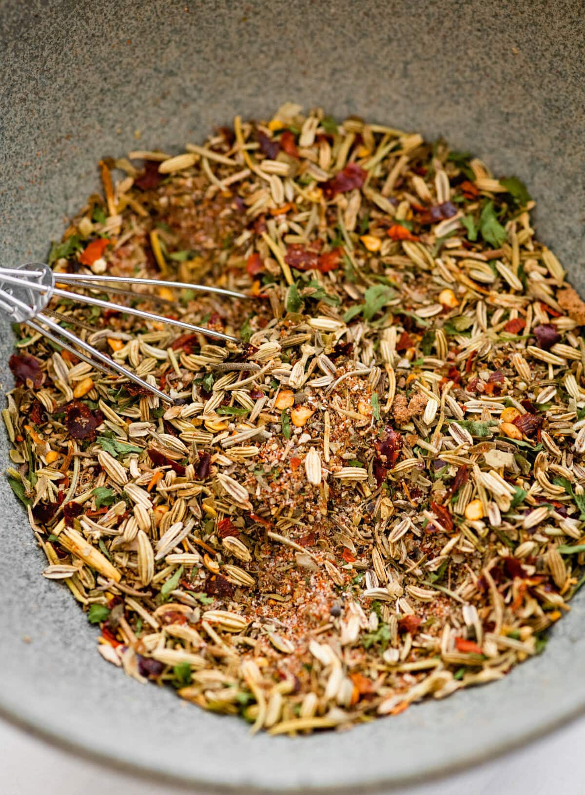 whisk in the small bowl to mix the herbs.