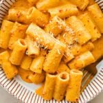 creamy nduja pasta in a bowl with a fork.