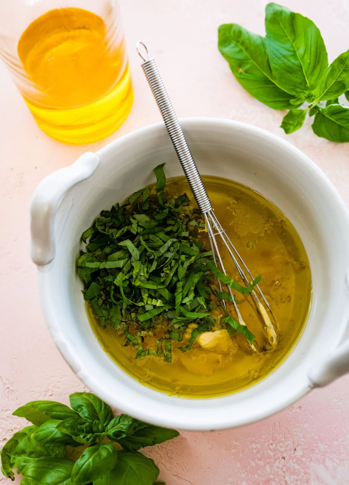 Dressing ingredients added to a bowl. 
