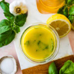 lemon basil vinaigrette on a marble background.