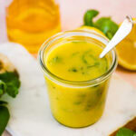 lemon basil vinaigrette on a marble background.
