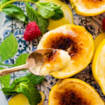 a bite with the spoon of the creamy lemon posset.