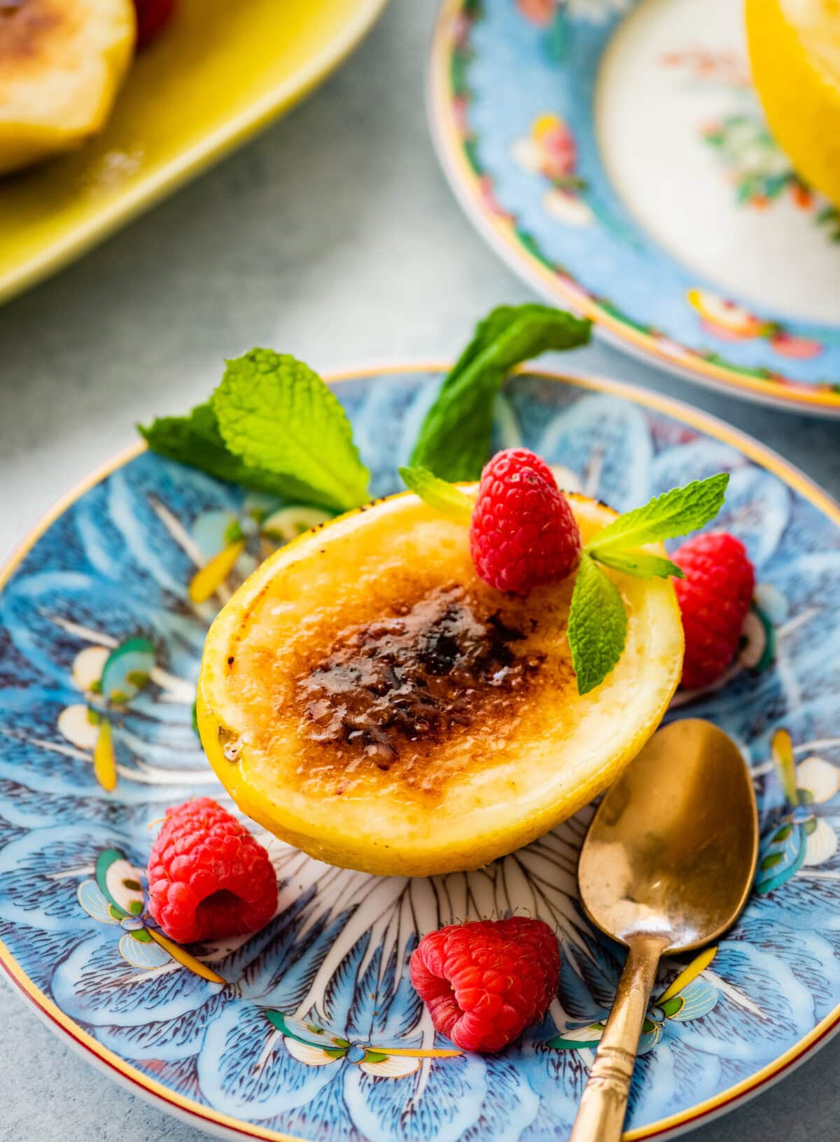 a bite with the spoon of the creamy lemon posset.
