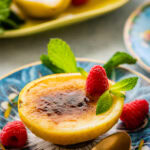 a bite with the spoon of the creamy lemon posset.