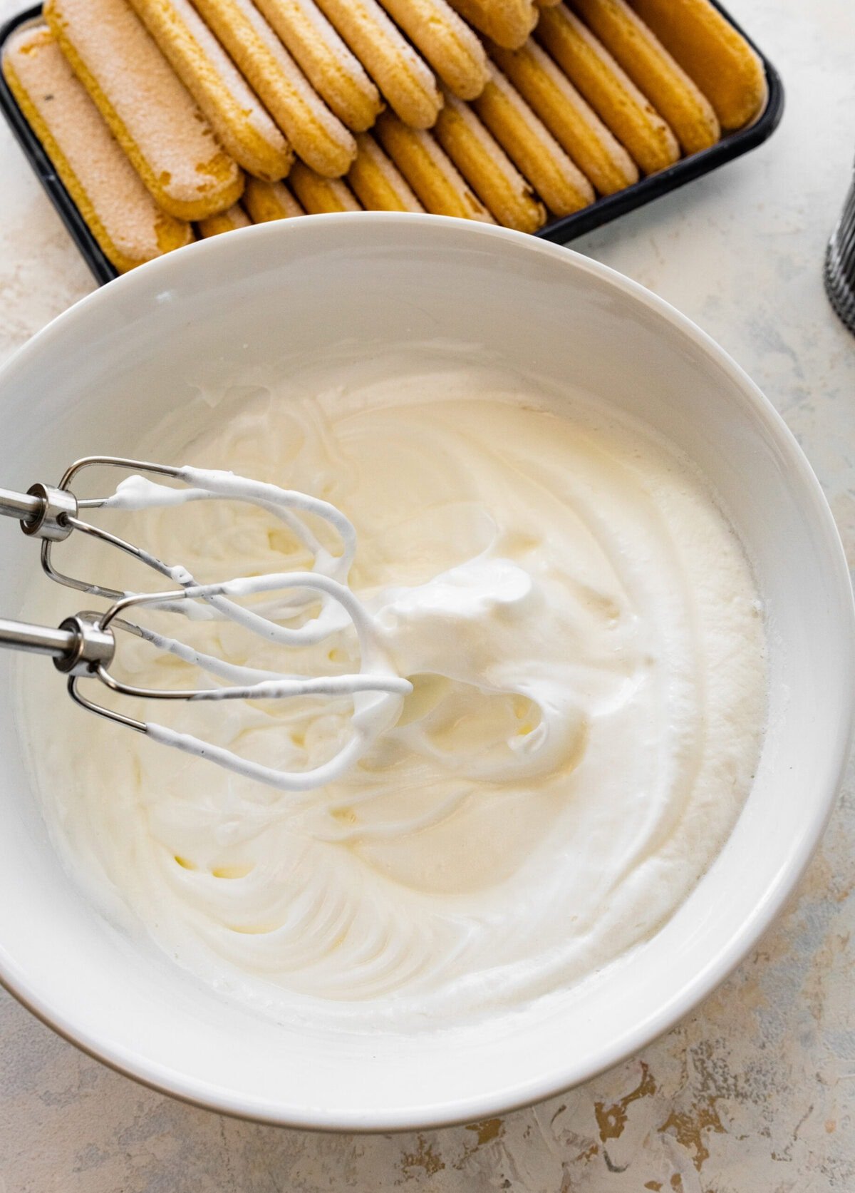 whipped egg whites to peaks in a bowl.