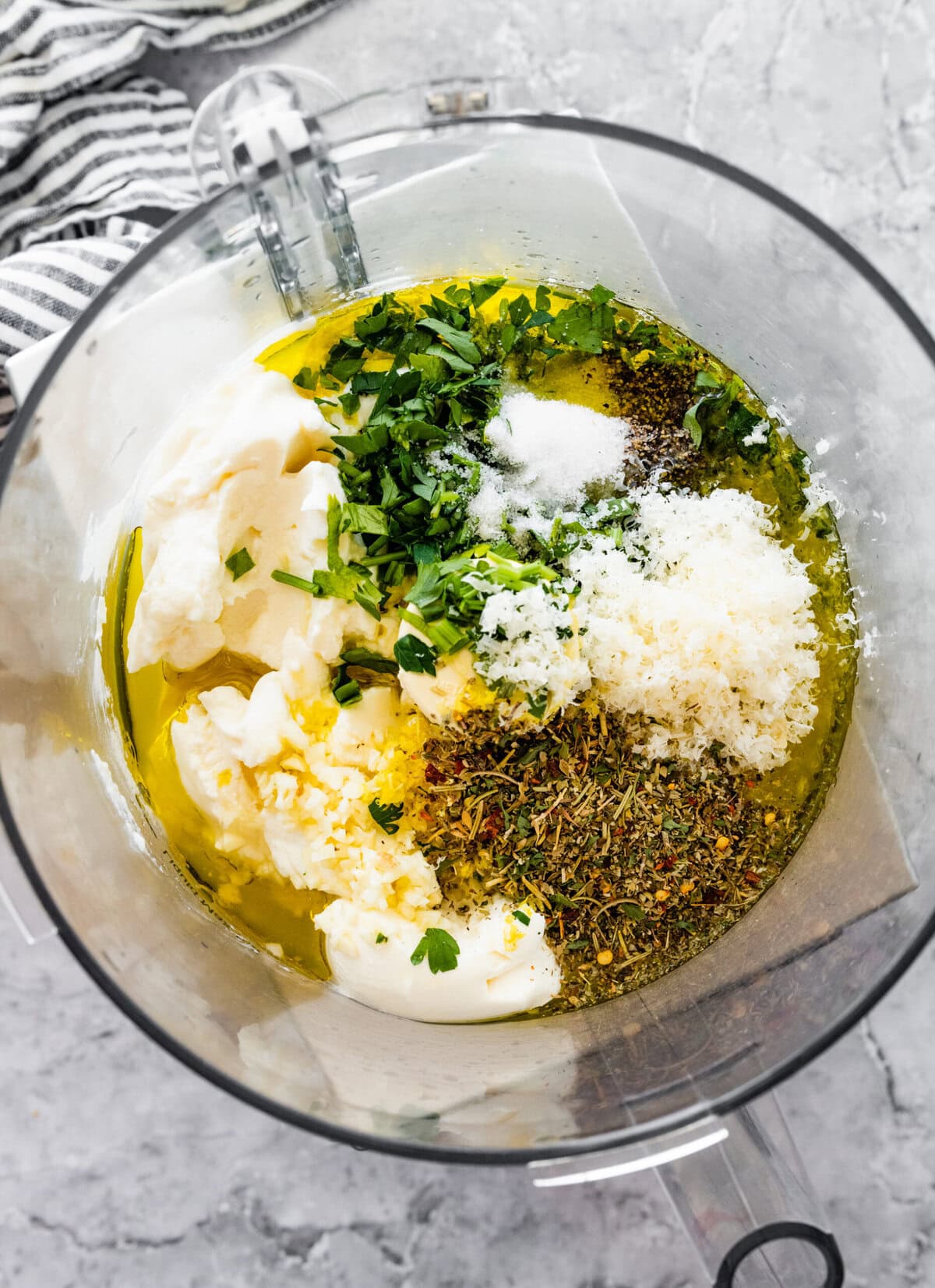 Ingredients for creamy Italian dressing in a blender ready to blend.