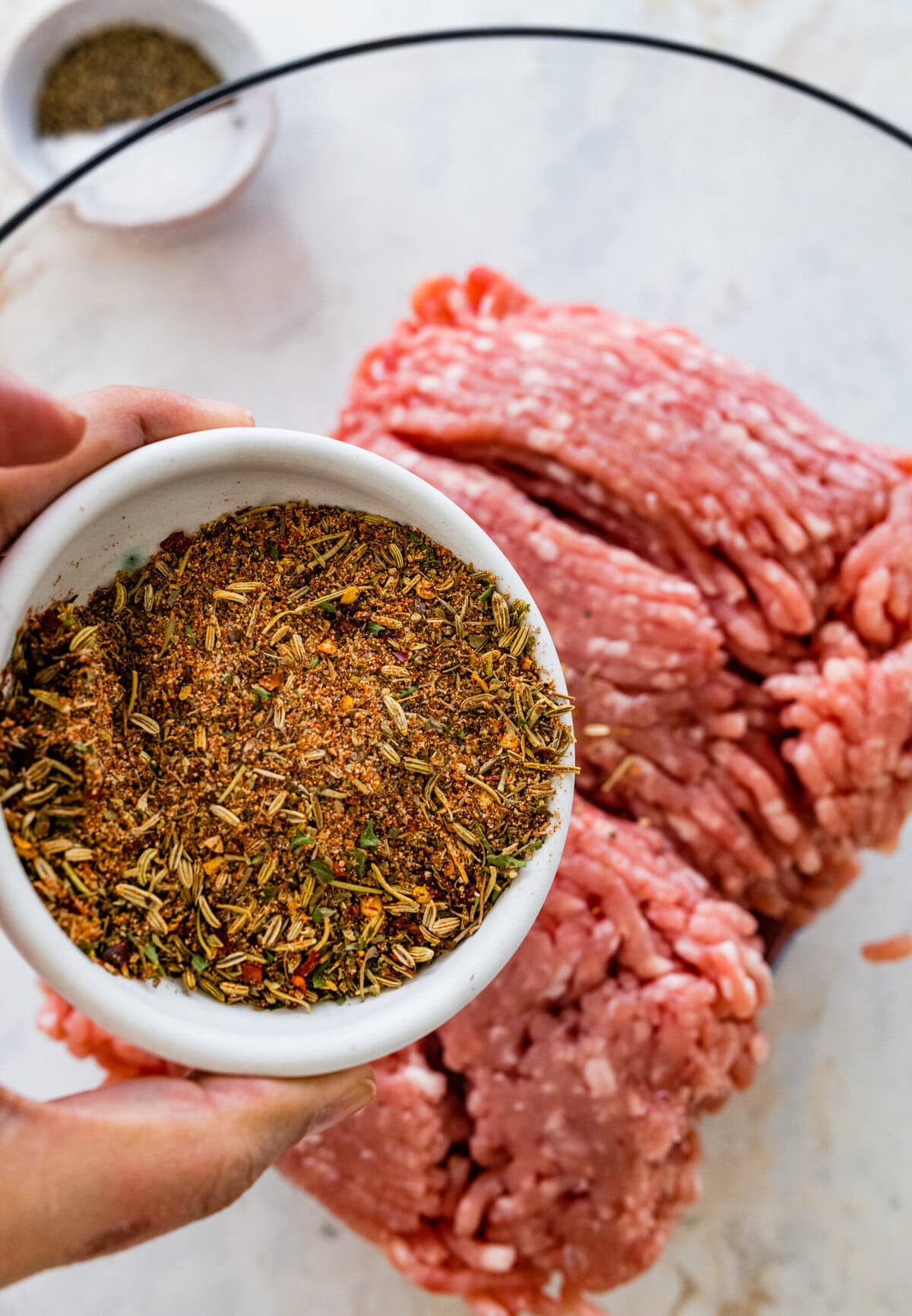 add the homemade Italian seasoning to the ground sausage mixture.