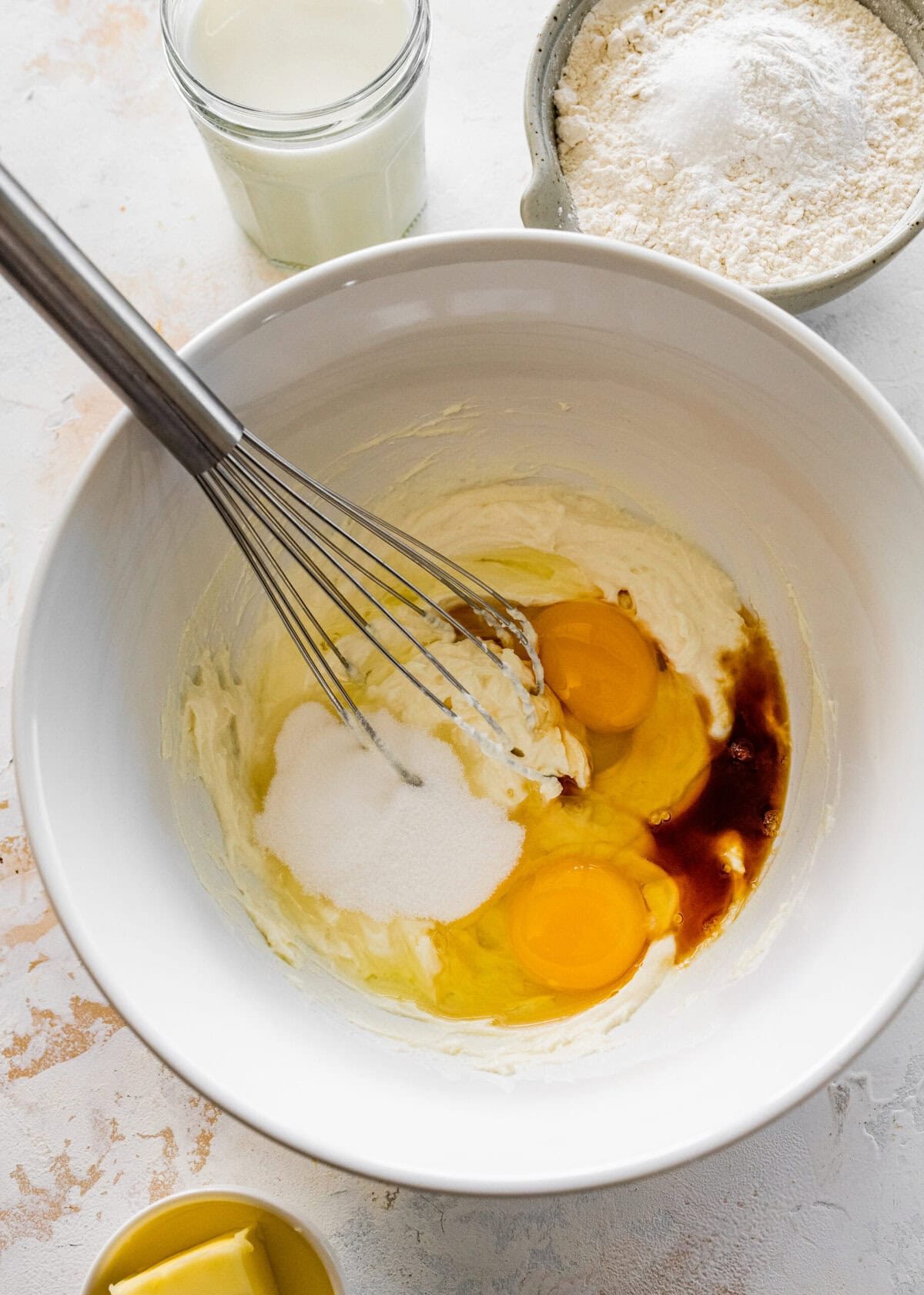 Eggs, butter, and flour in a bowl