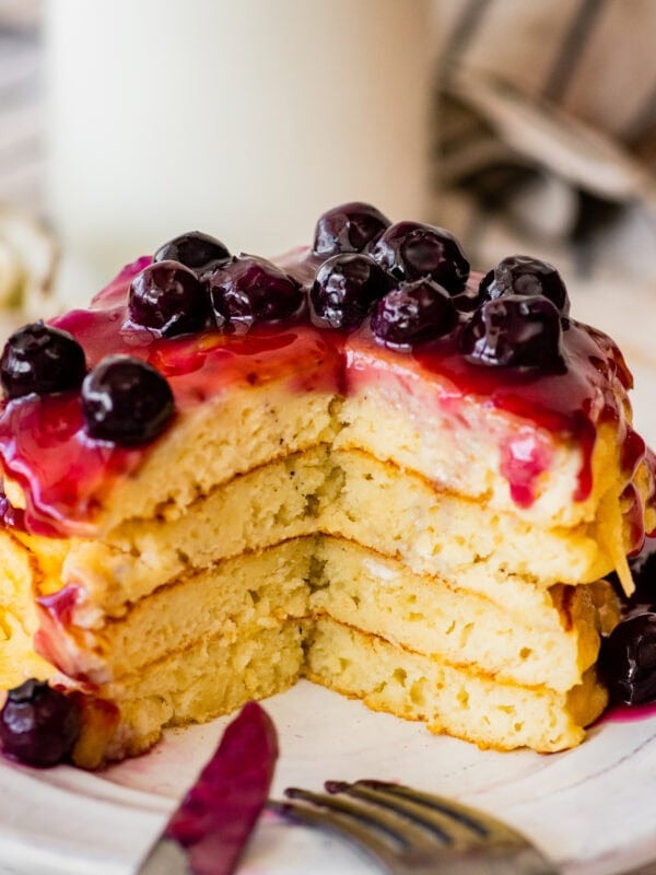 Blueberry pancakes with a slice cut out