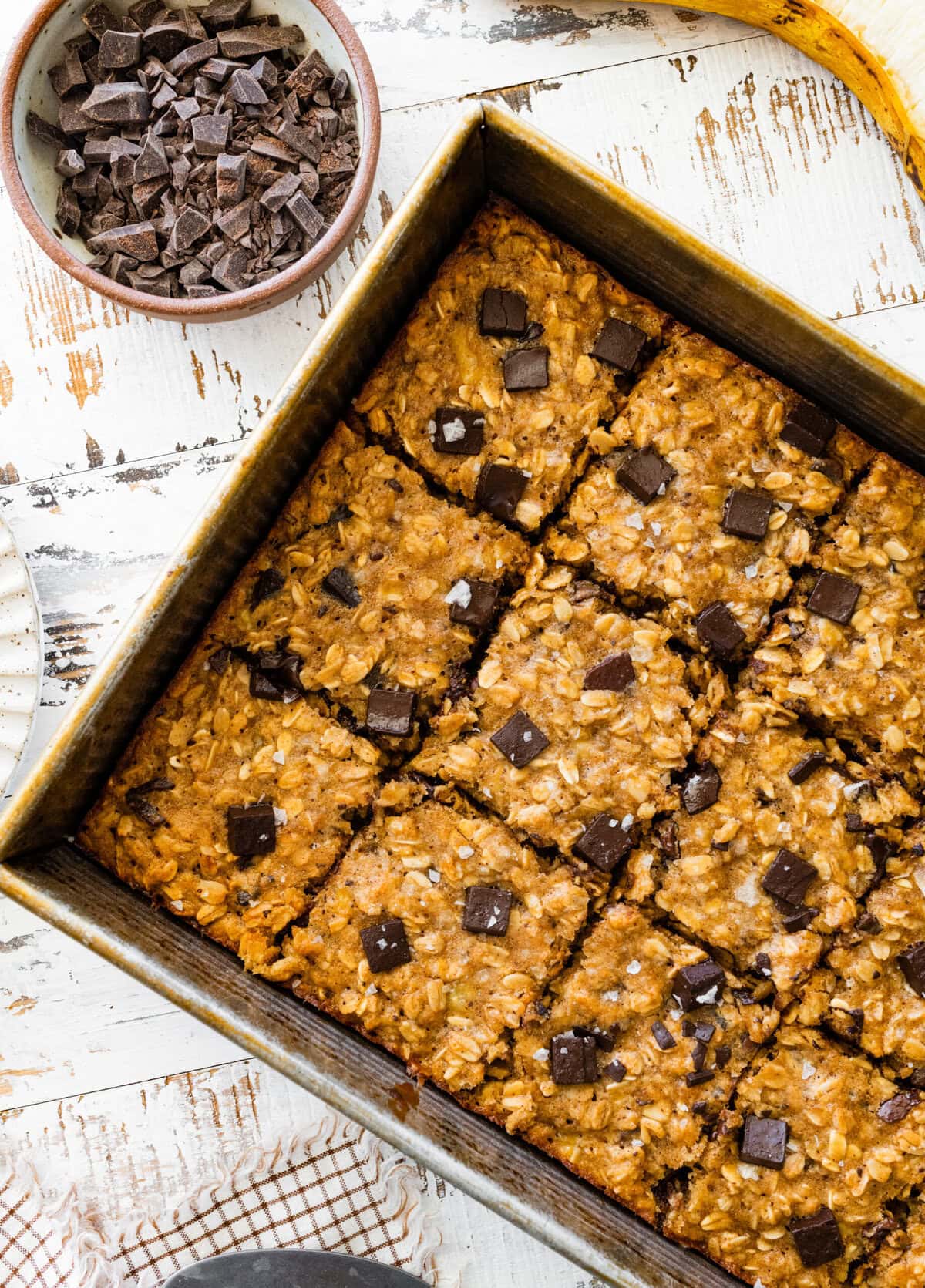 A pan of banana chocolate chip oatmeal bars. Cut into squares.