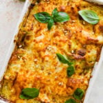A casserole dish with baked pesto lasagna.