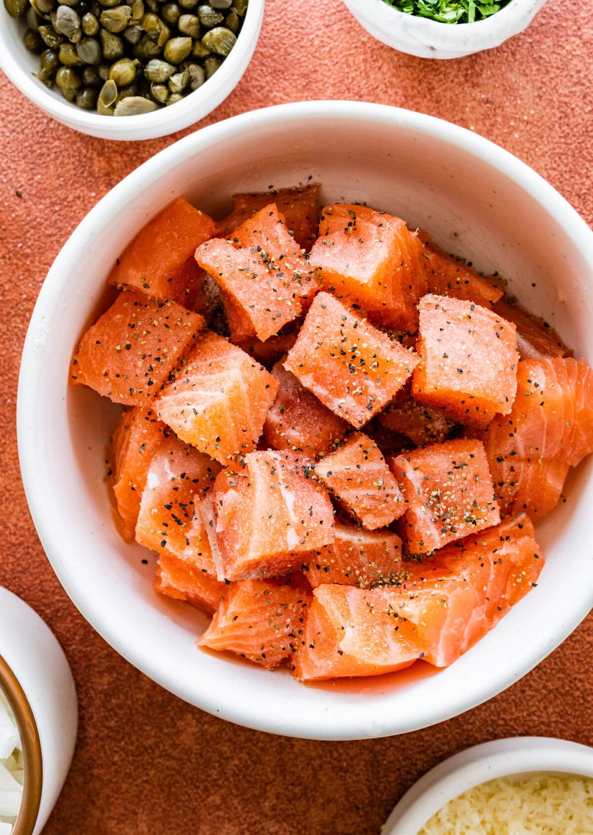 Bowl of salmon cut in cubes for creamy salmon pasta.