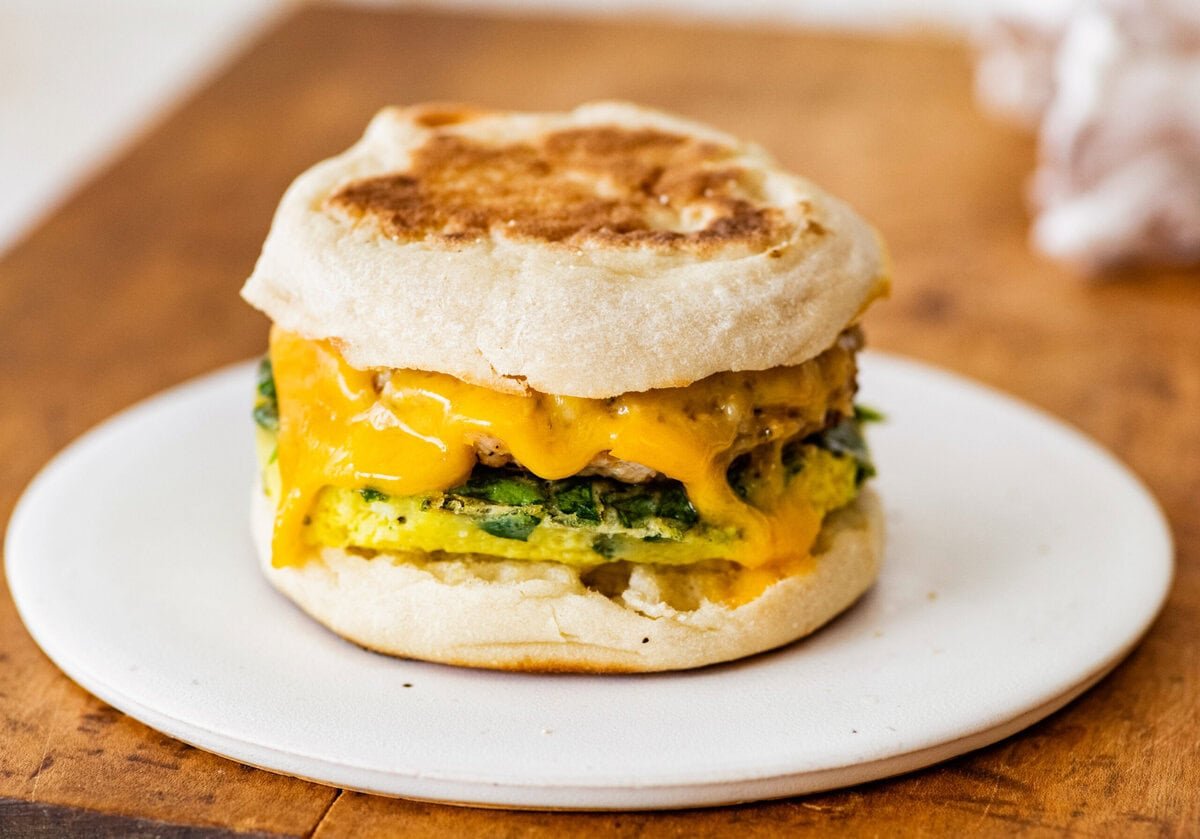 breakfast sandwich with melted cheese.