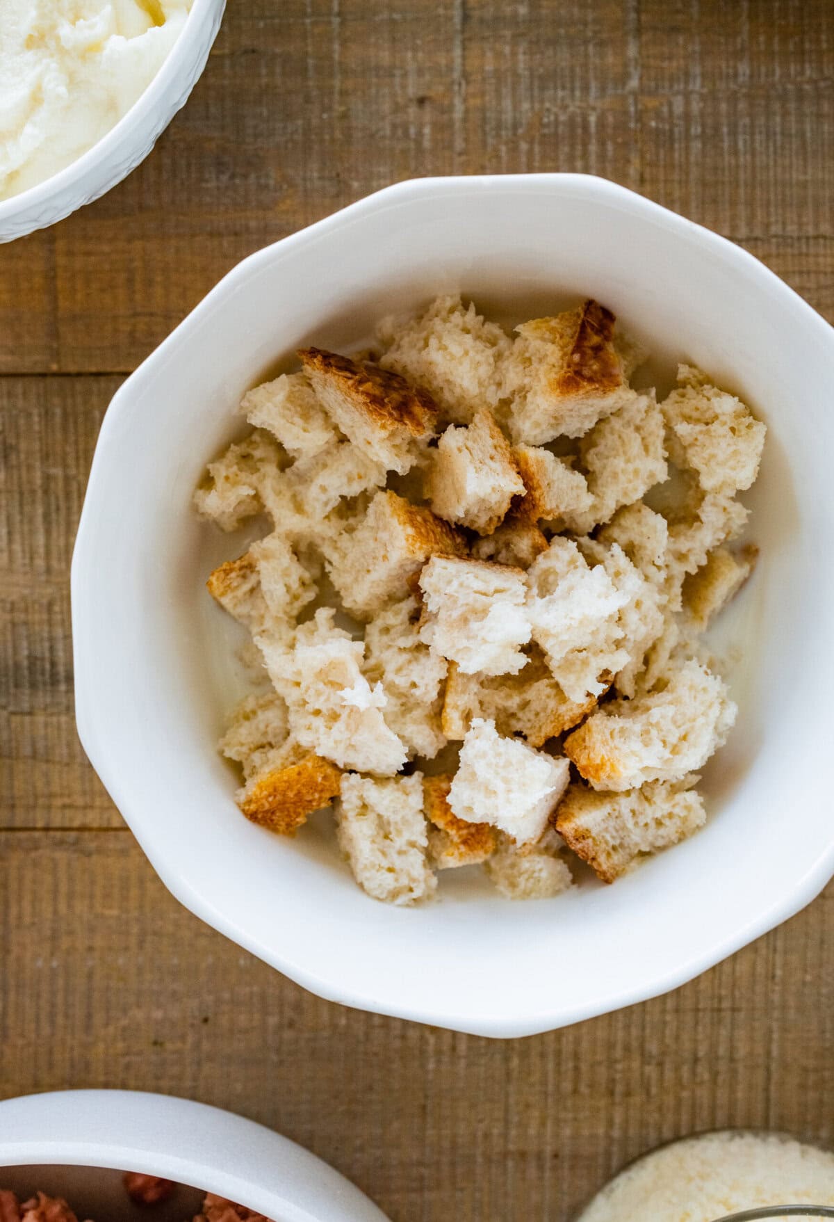 A bowl of bread soaking in milk.