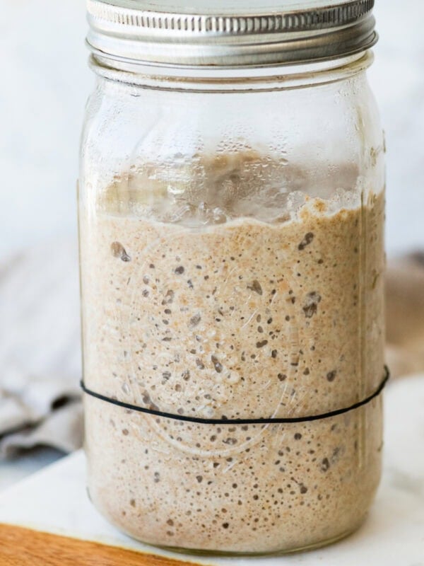 A mason jar filled with a homemade sourdough rye starter. Ready to use.