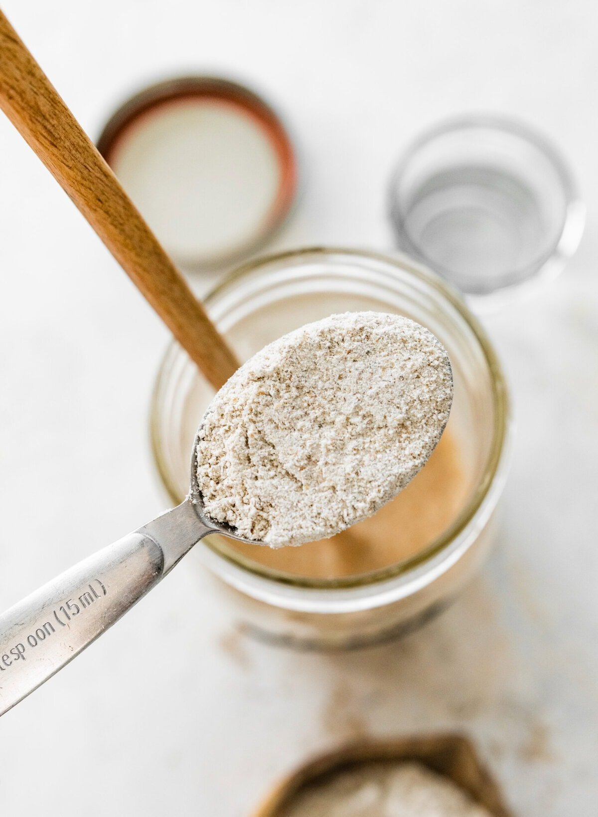 Adding flour to the sourdough rye starter.