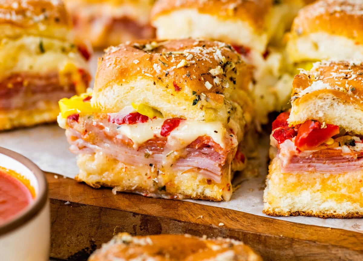 Italian sliders warm out of the oven with all filling visible.