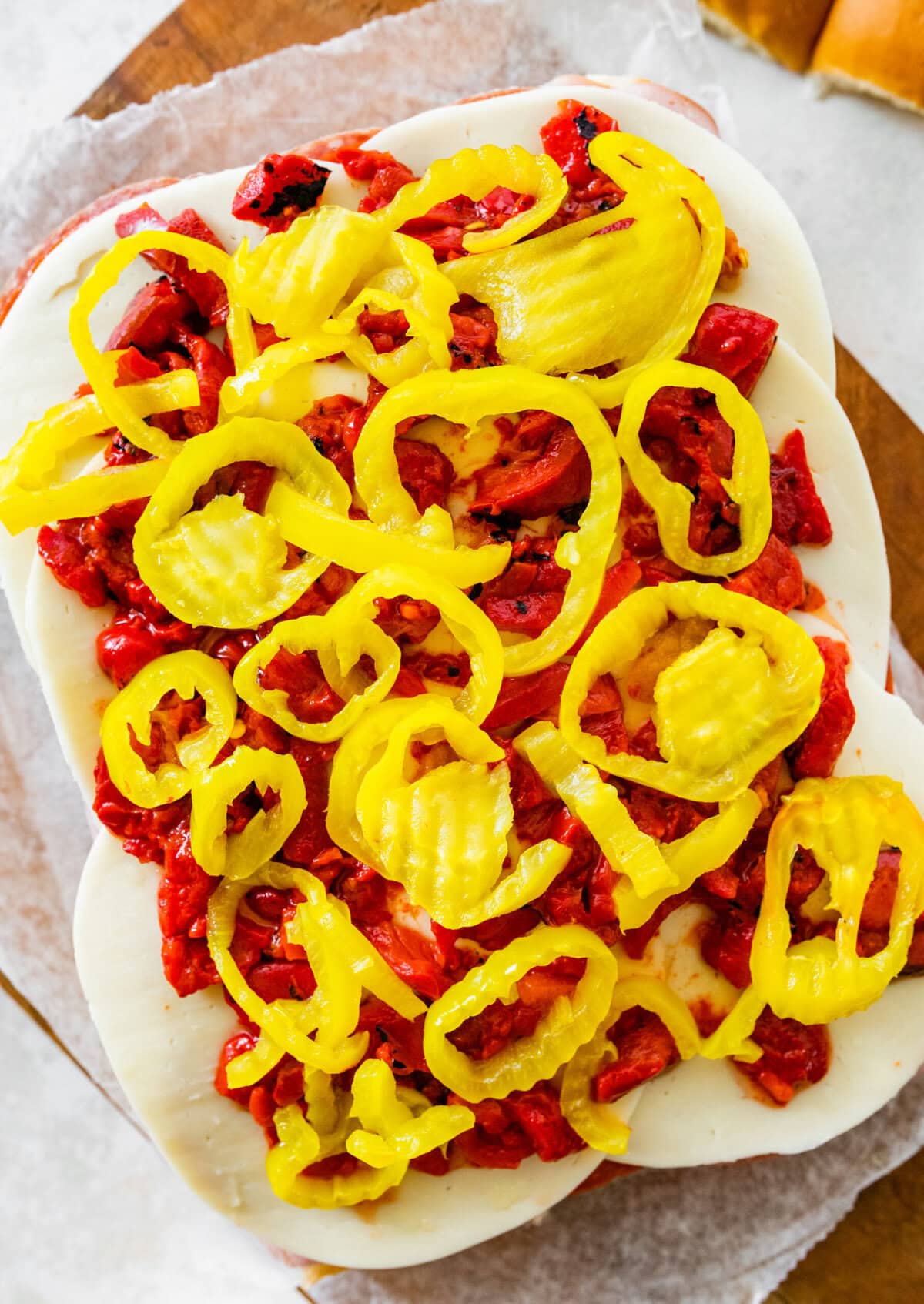 Layering the ingredients for the Italian sliders.