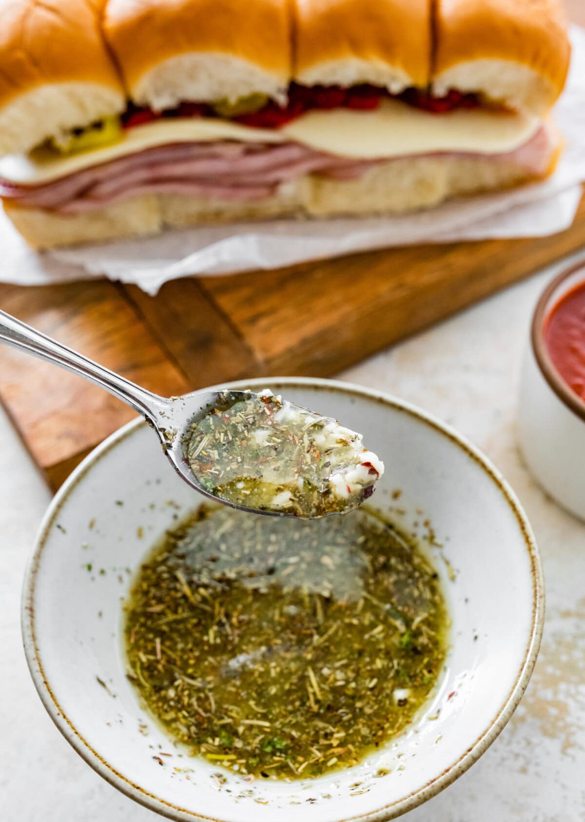 Garlic herb butter for the Italian sliders in a small bowl.