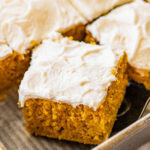 delicious pumpkin bar square with cream cheese frosting on top.