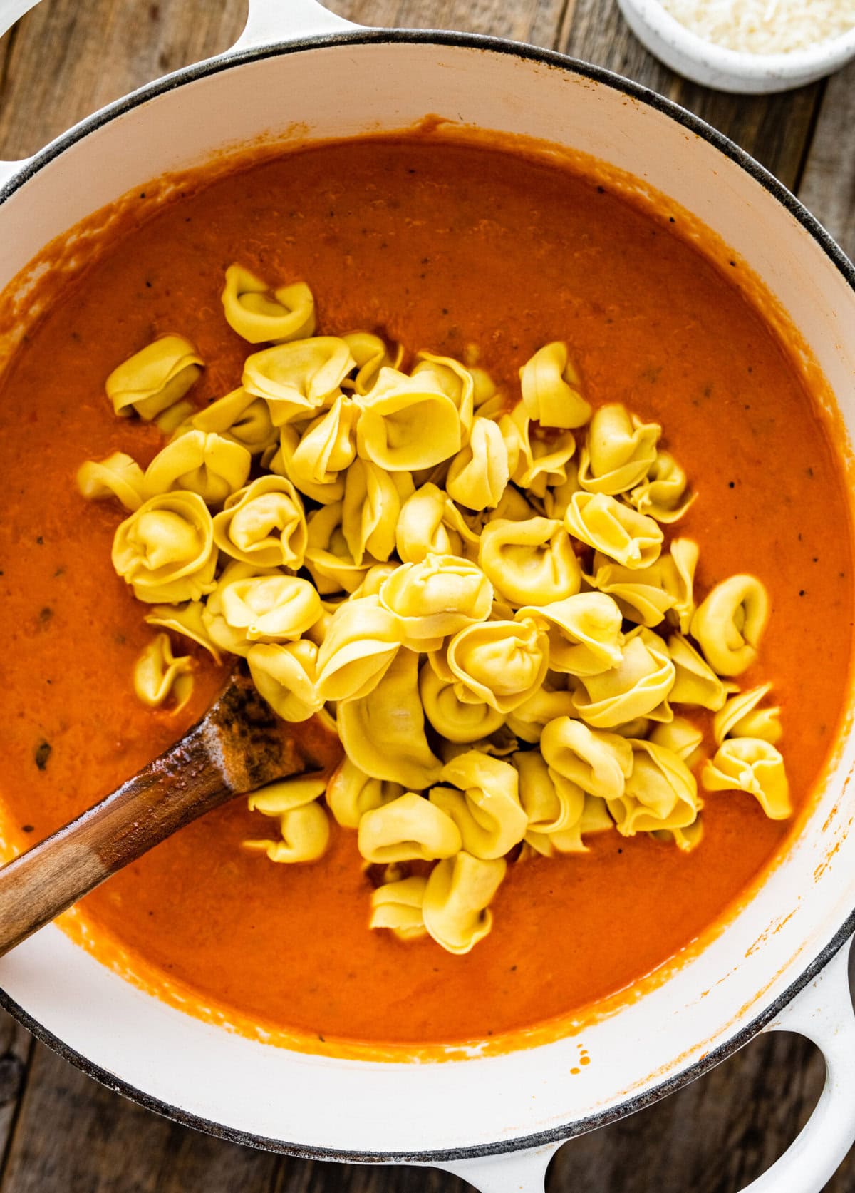 adding the tortellini in the tomato soup recipe.