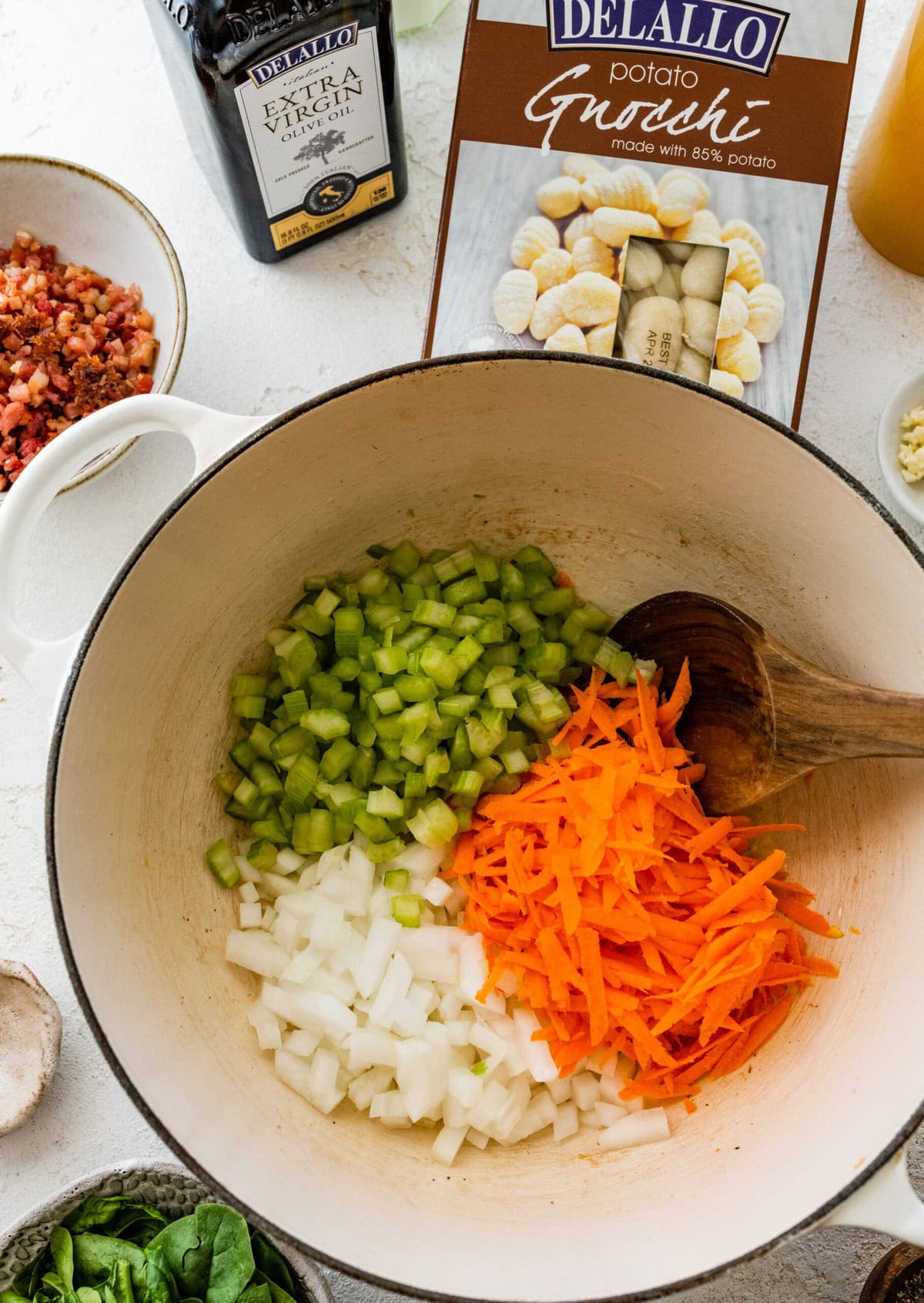 adding the soffritto to the soup pot.