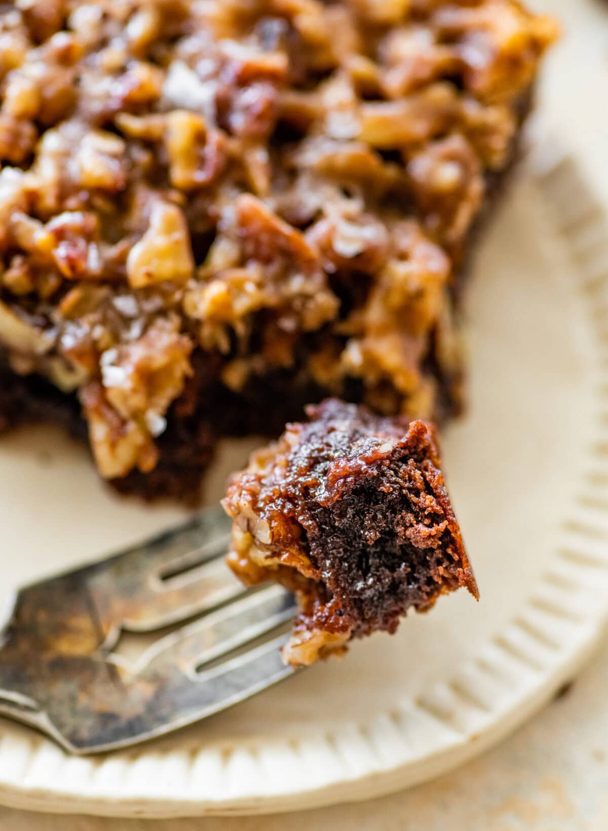 bite of pecan pie brownie on a fork.