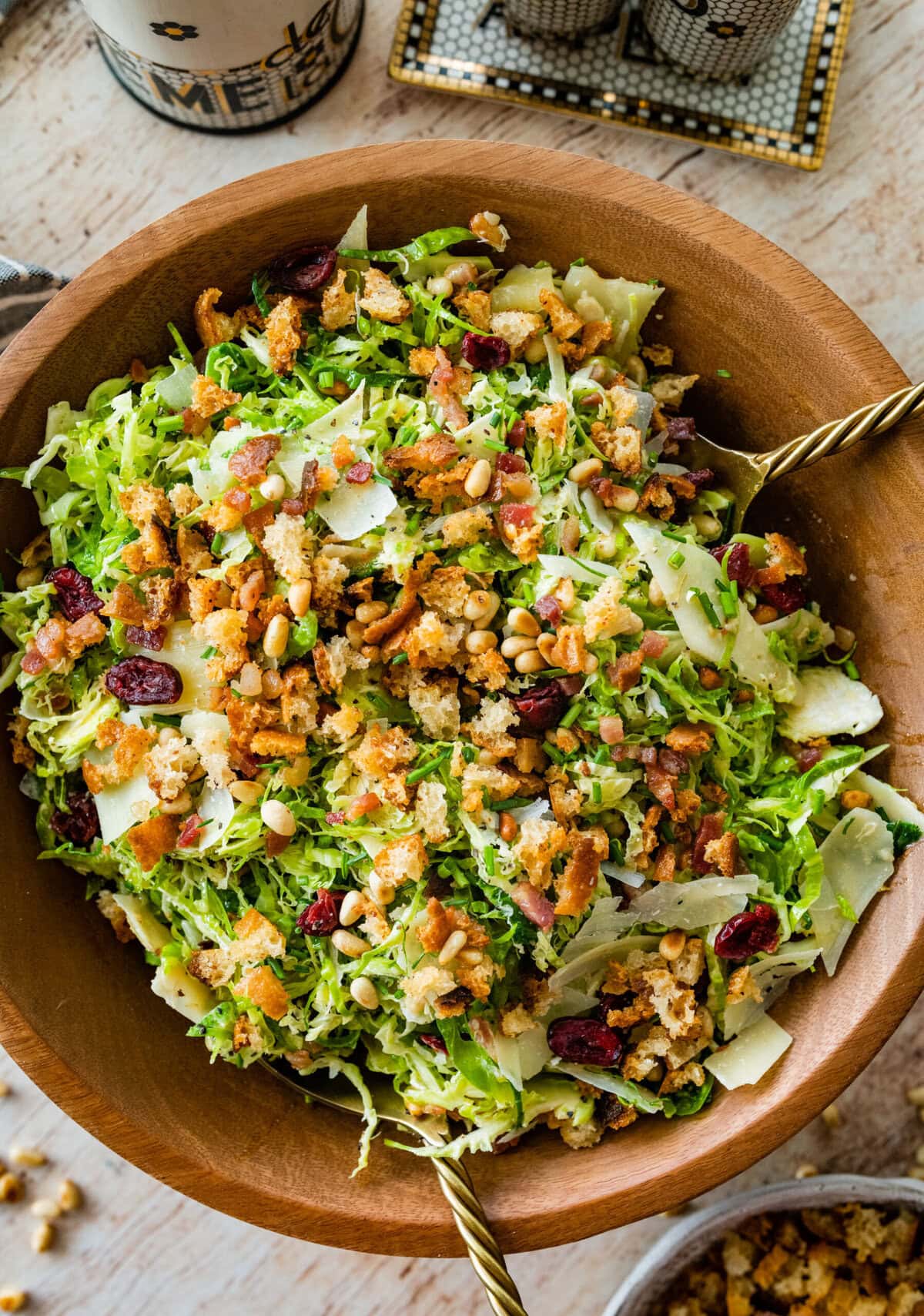 shaved brussels sprouts salad in a wooden salad bowl ready to serve.