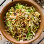 shaved brussels sprouts salad in a wooden salad bowl ready to serve.