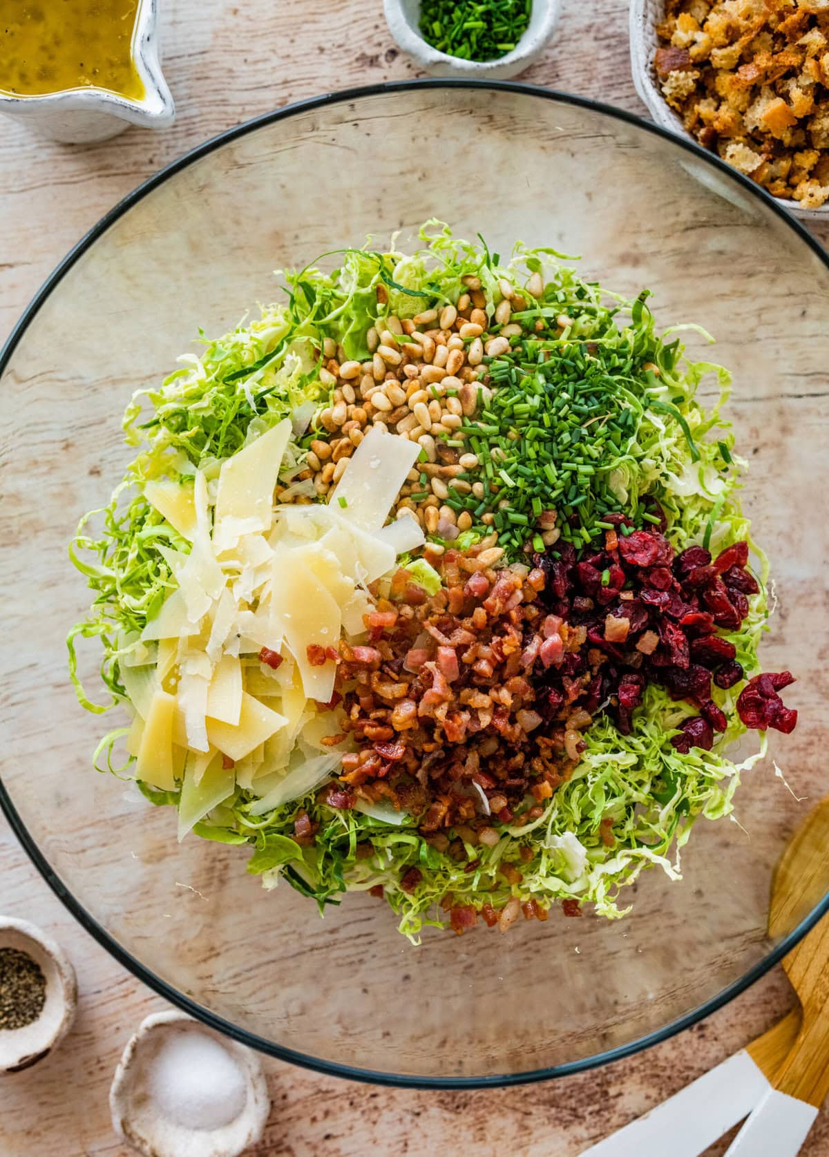all brussels sprouts salad ingredients in a large salad bowl.