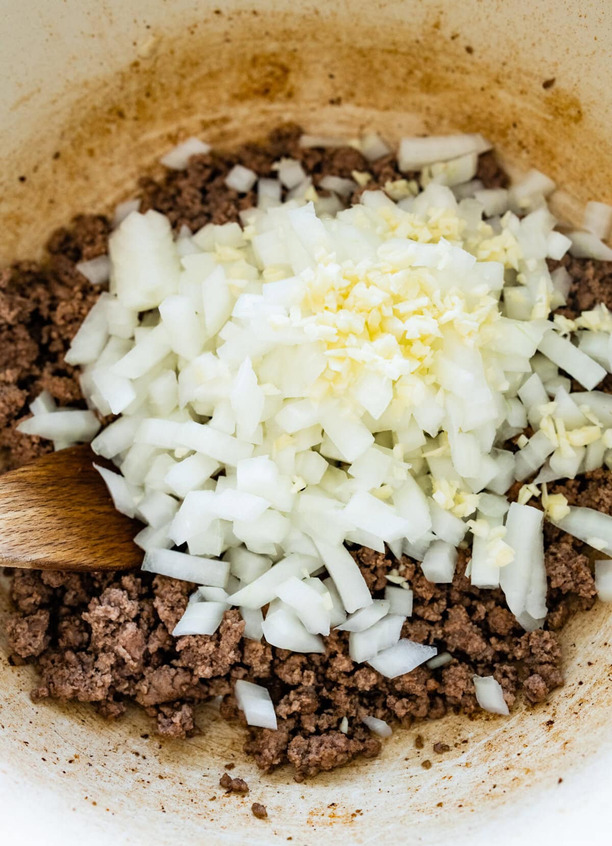 onions and beef frying in a pot for taco soup.