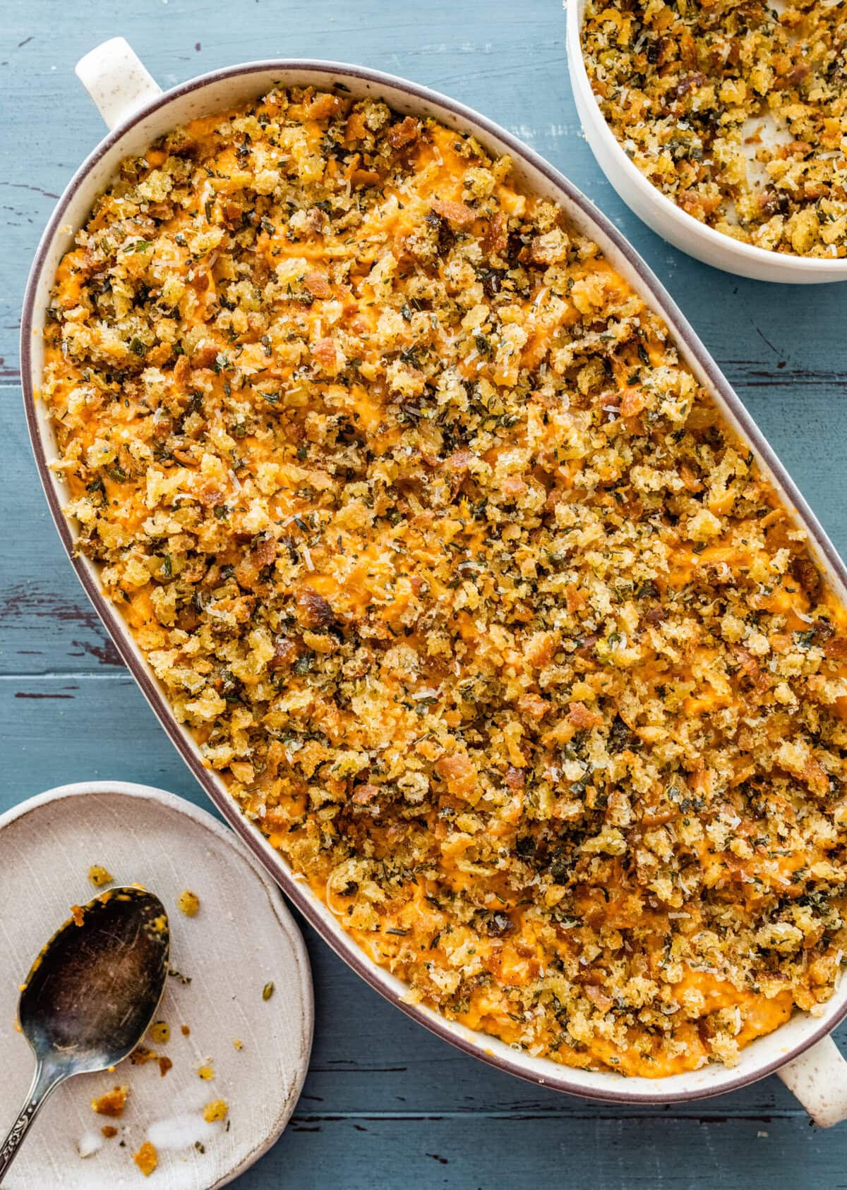 savory sweet potato casserole in an oval baking dish.
