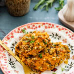 savory sweet potatoes on a plate with a fork.