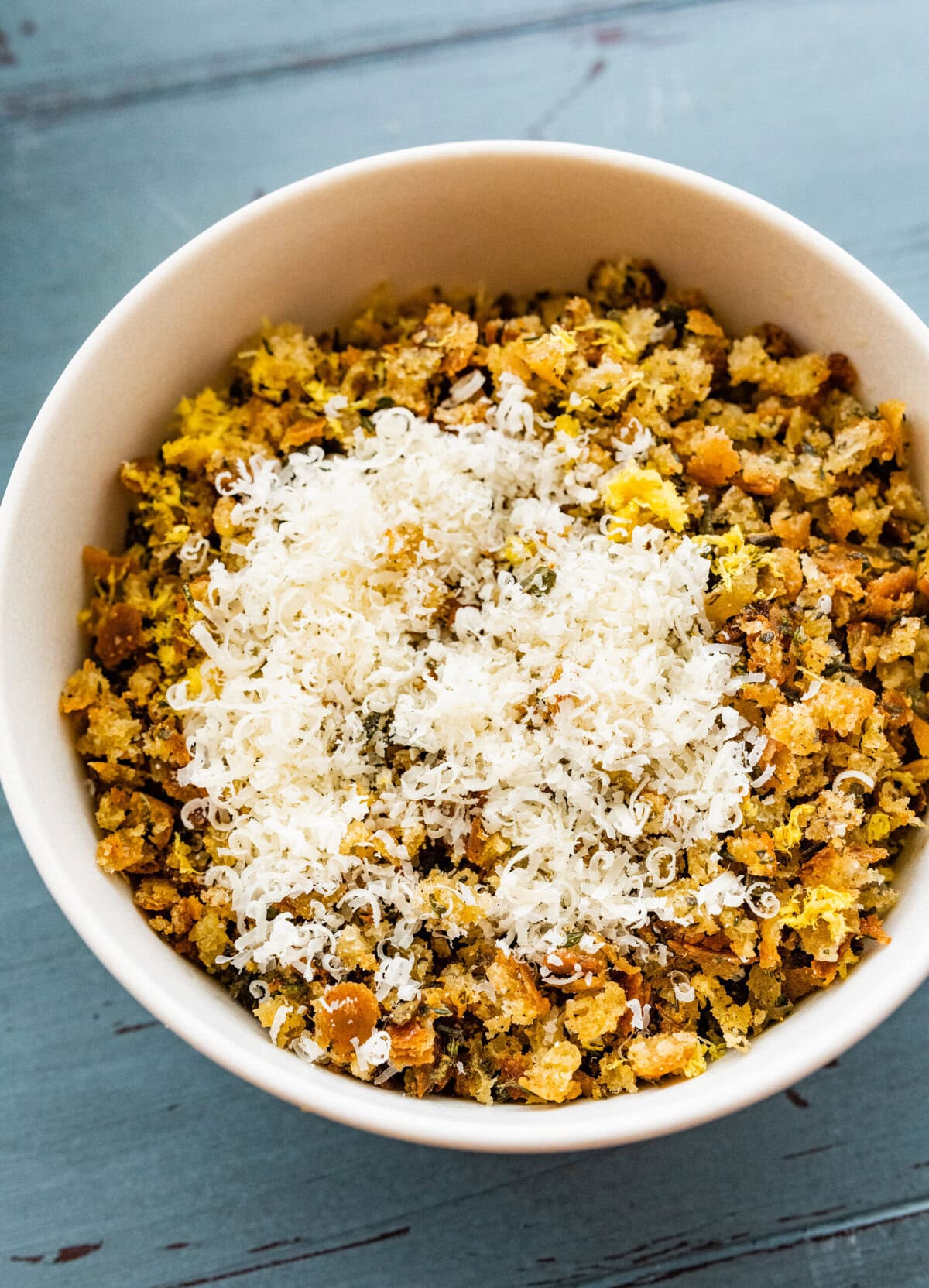 toasted heb bread crumbs with parmiginao cheese on top.