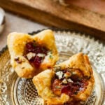 two brie bites on a Thanksgiving plate ready to eat.