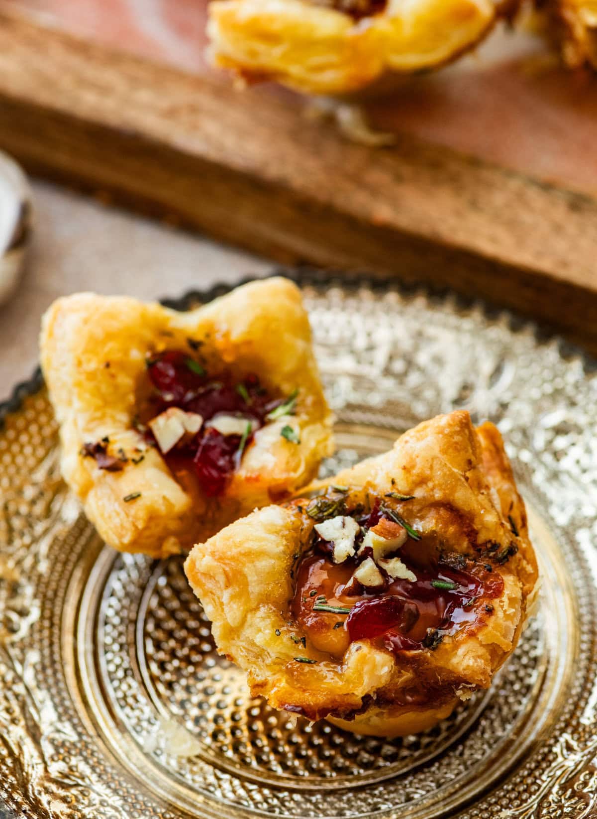 two brie bites on a Thanksgiving plate ready to eat.