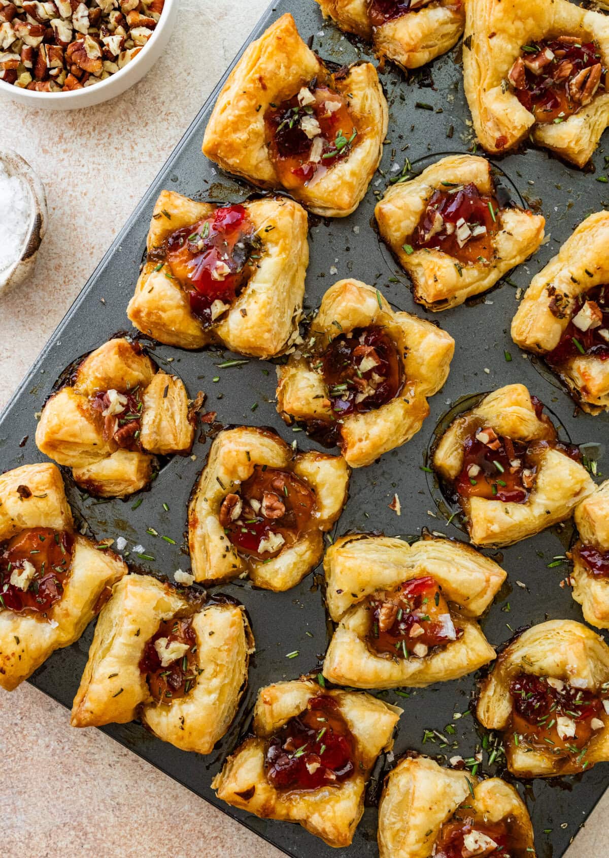 baked brie bites in muffin tin nice and puffed up ready to eat.