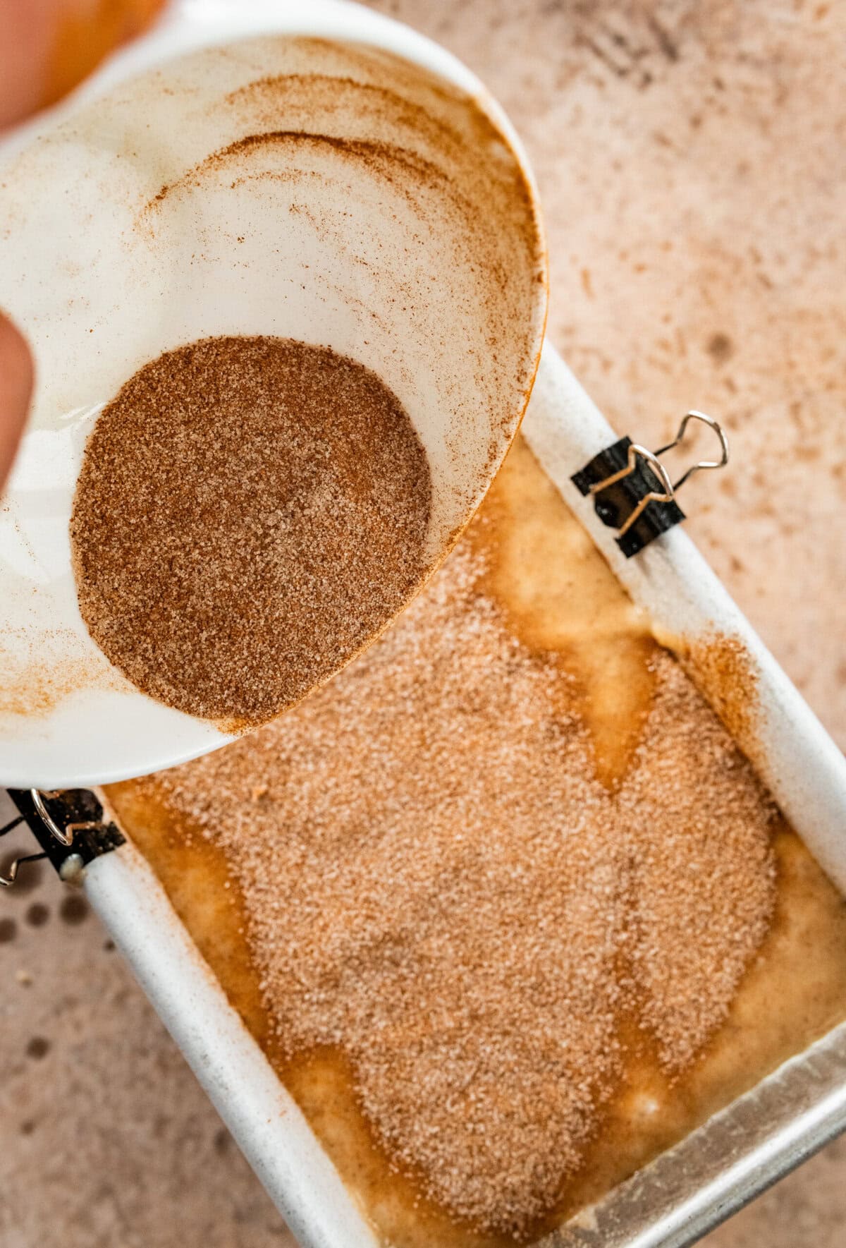 pour batter into prepared pan and add half of the cinnamon sugar on top.